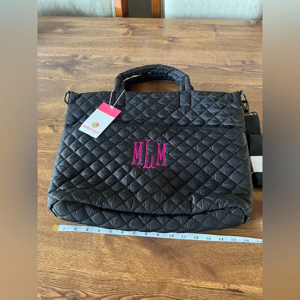 Marleylilly monogrammed black quilted laptop bag with the initials MML